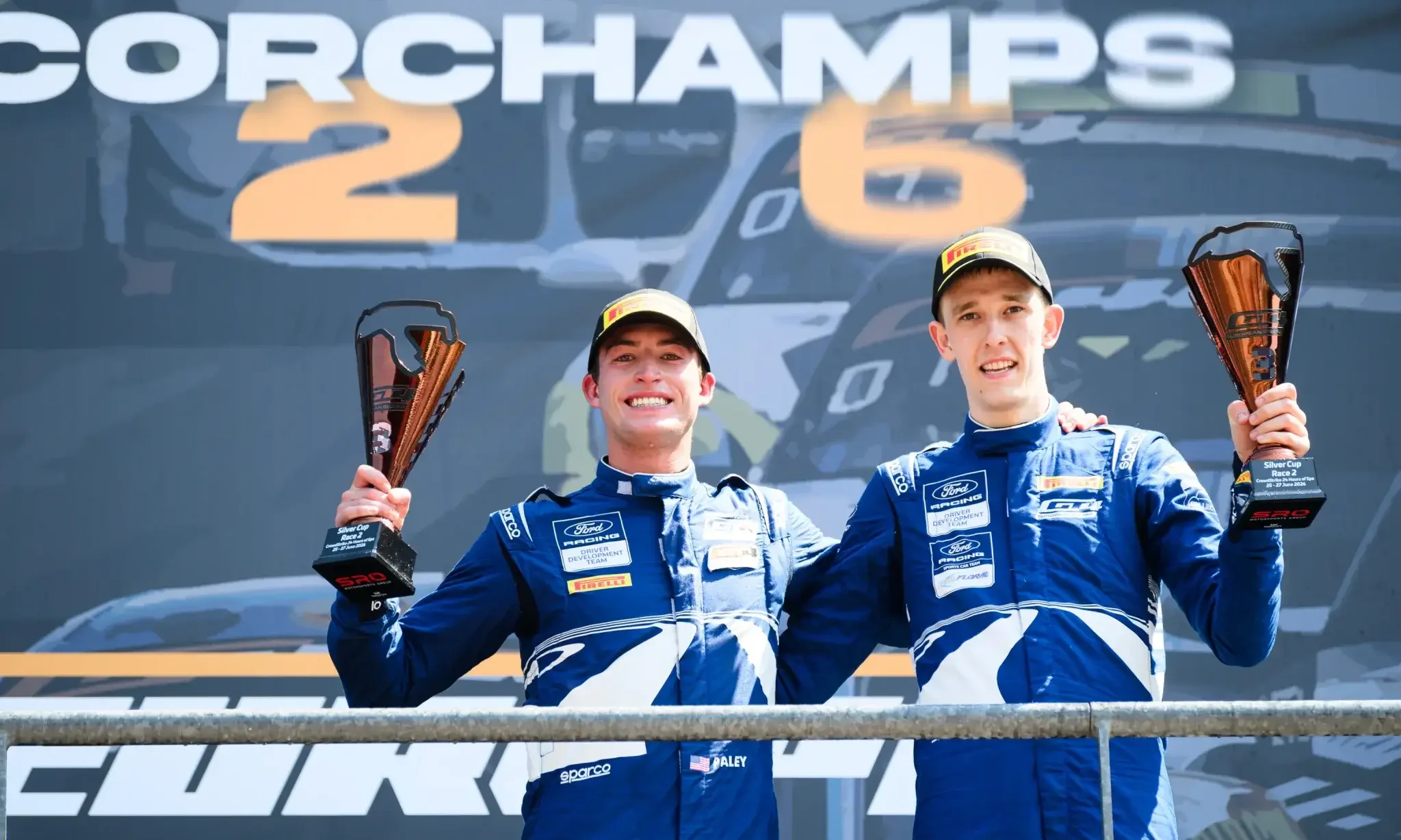 Racing Drivers Sam Paley and Michiel Haverans Smile and Hug on Top of the Spa-Francorchamps Podium.