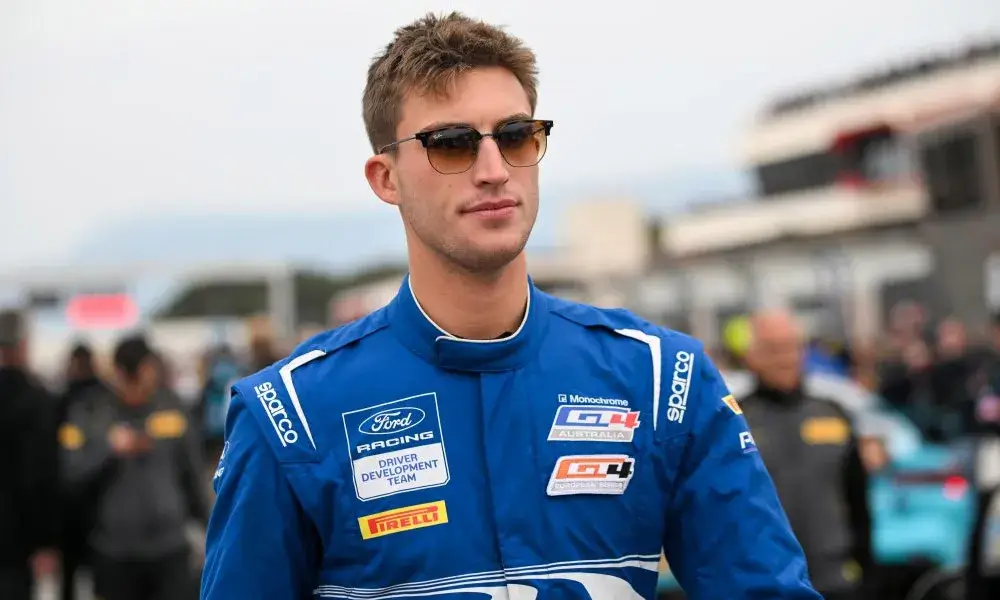 Sam Paley Walking Down the SRO GT4 Racing Paddock.